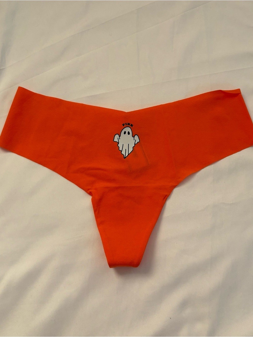 PINK Victoria's Secret Orange Seamless Thong with Ghost Graphic